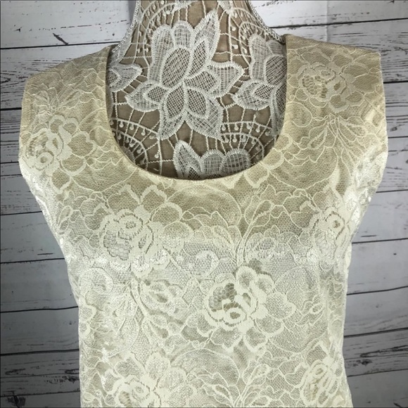 Leslie Fay sleeveless 
Beautiful lace dress with layered ruffles on the end. - Picture 9 of 12